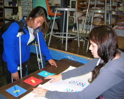 Two kids exploring colors for design improvements