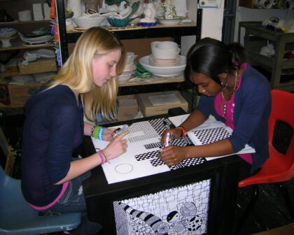 Two kids exploring designs