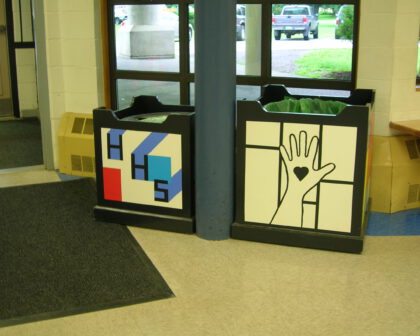 Trash bin coverspainted with Mondrian theme and HHS high-five theme