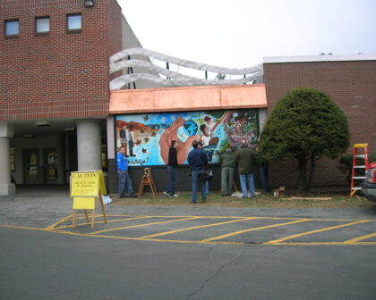 Exterior mural being installed